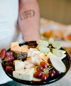 Professional chef in striped apron preparing food in commercial kitchen