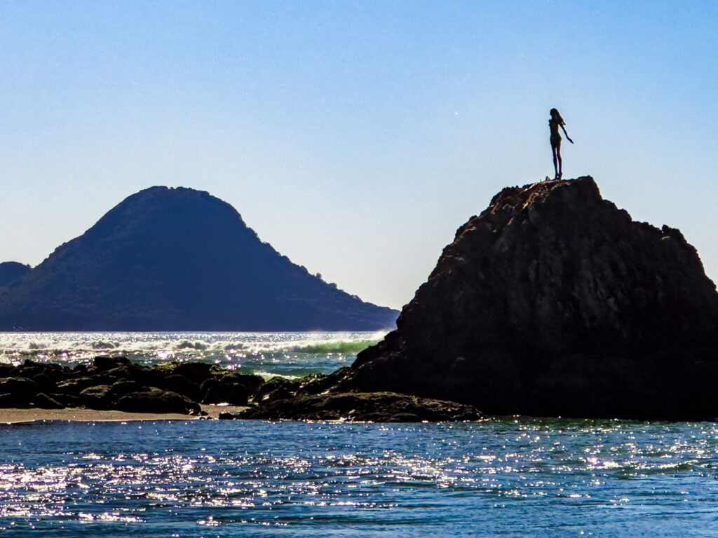 Lady on the Rock statue overlooking Whakatāne Harbour at sunrise