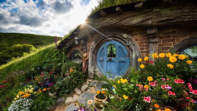 Hobbit-style cottage with flower garden walkway